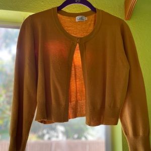 50’s style chic vest mustard orange. This price was from a 50’s themed botique.